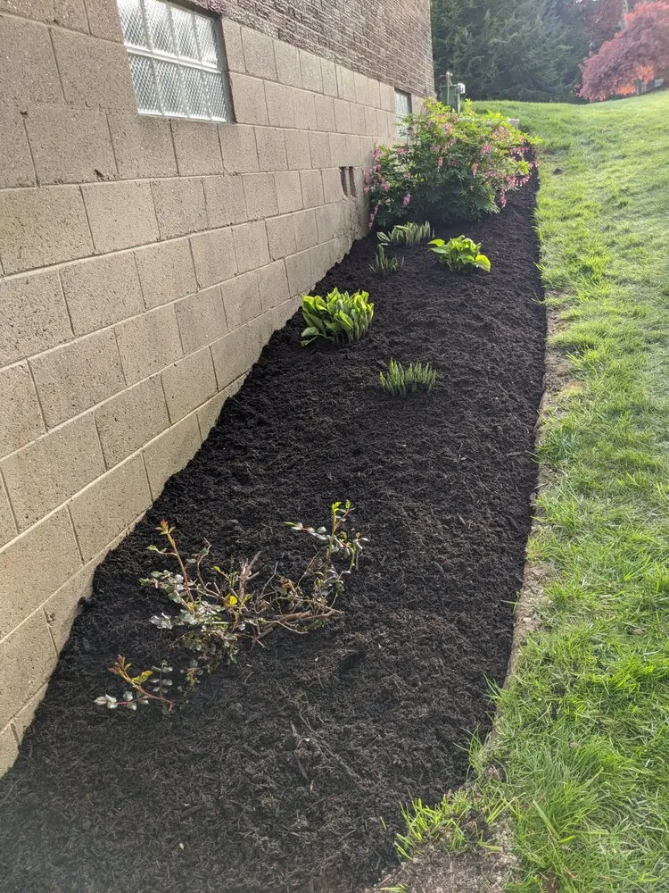 Custom landscape installation for residential properties in Coraopolis, PA by T & T Landscaping