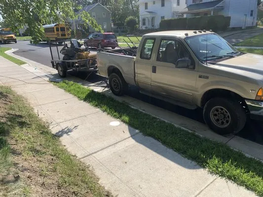 TaLanie Lawn Care Logo