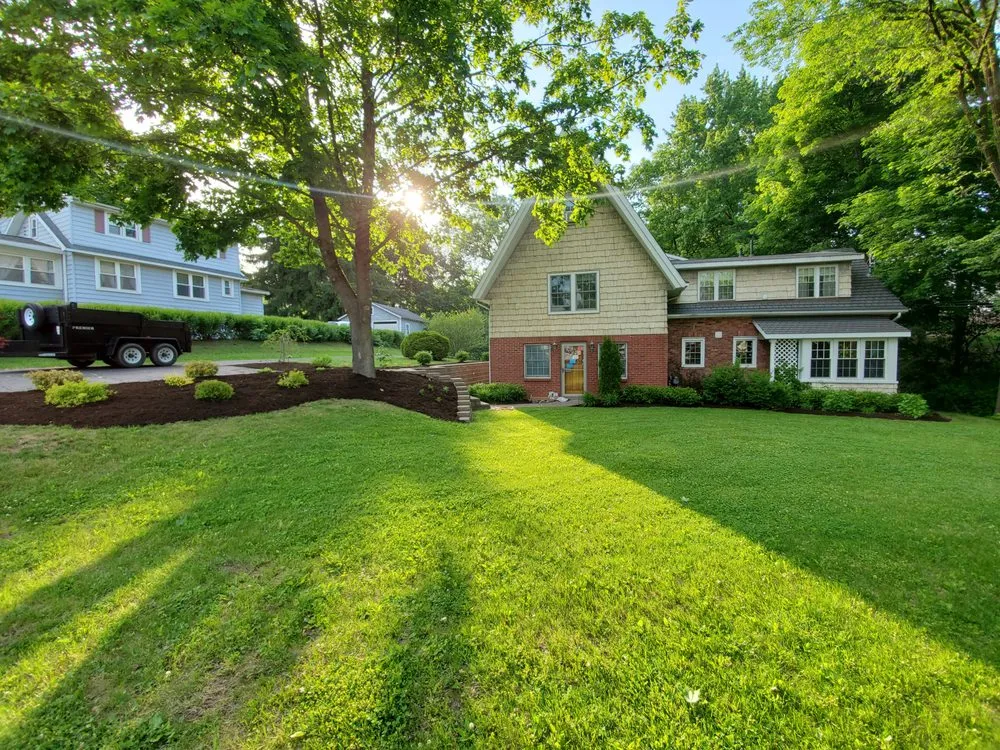 Custom lawn mowing service for year-round maintenance across Latham, NY - Tall oaks lawn and landscaping
