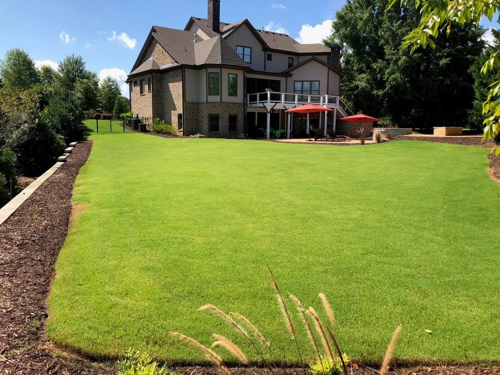 Professional yard maintenance for year-round maintenance in Buford, GA by Terra Designs and Creations