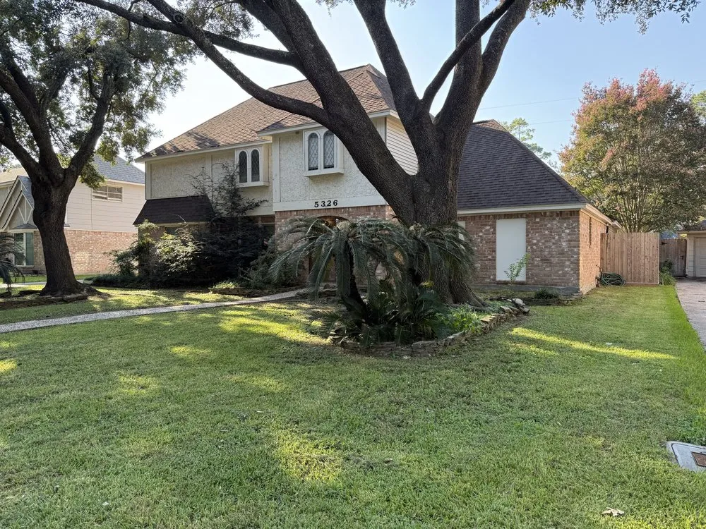 Custom landscape installation for year-round maintenance in Houston, TX by Texas Lawn Services