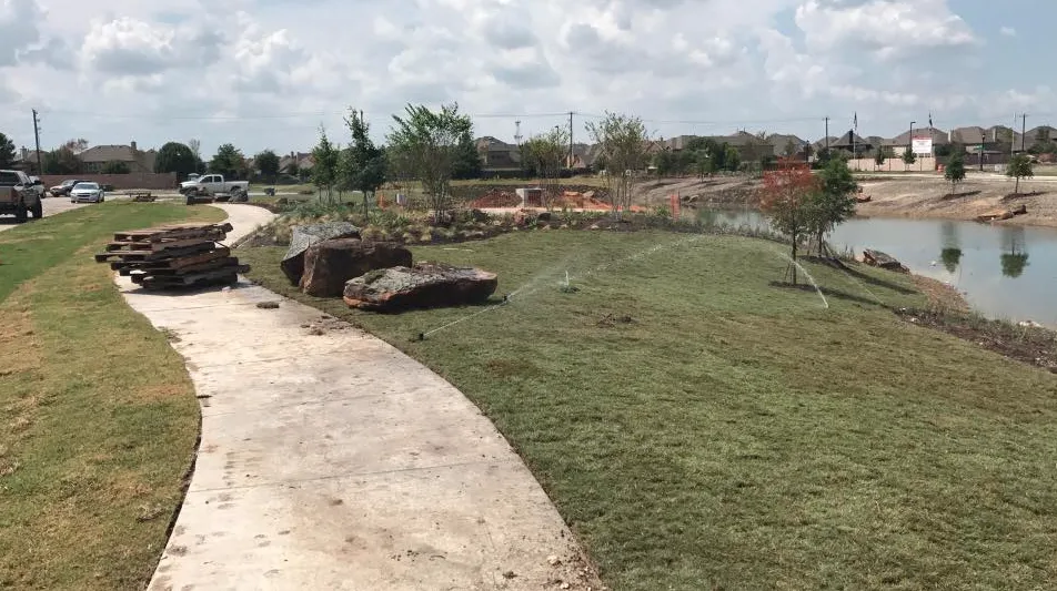 Expert lawn mowing service for residential properties in Little Elm, TX by Texas Rainman