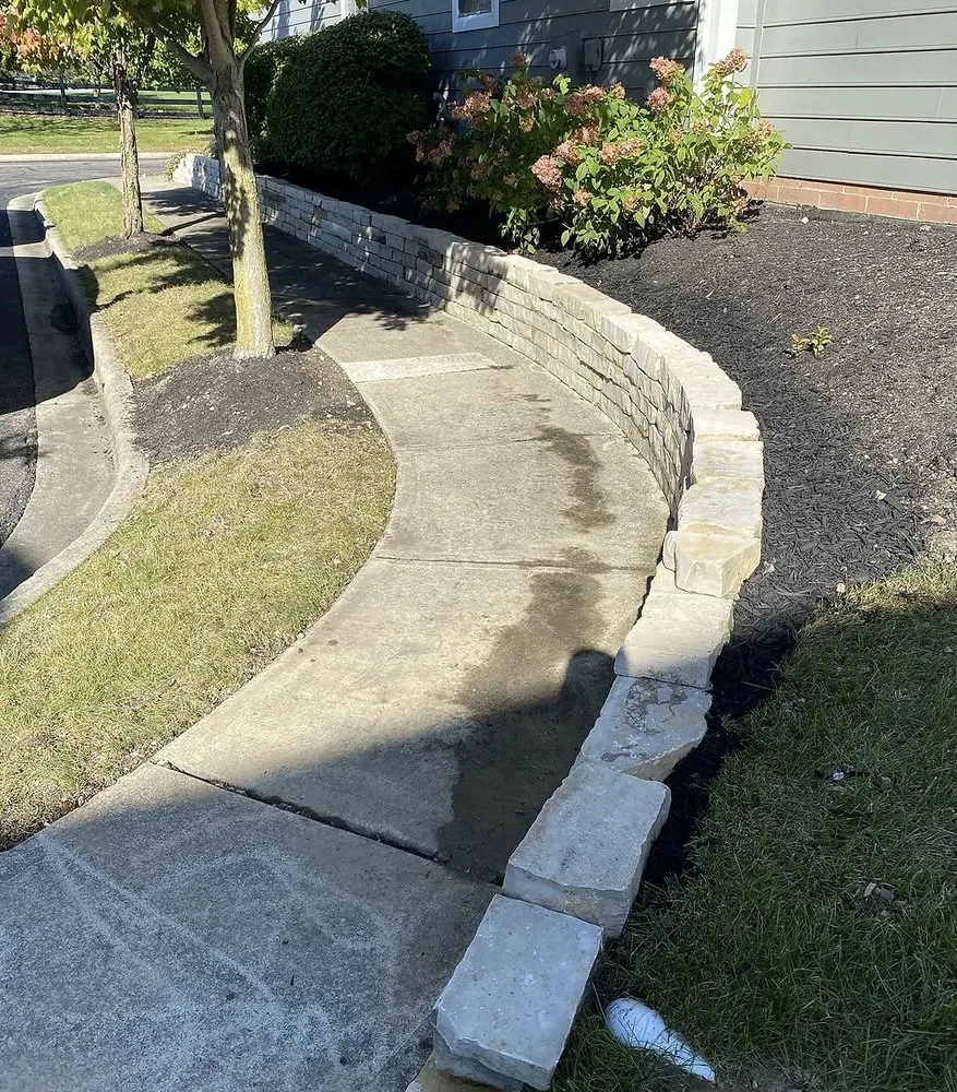 Custom lawn mowing service with custom design in Powell, OH by Tharpscapes