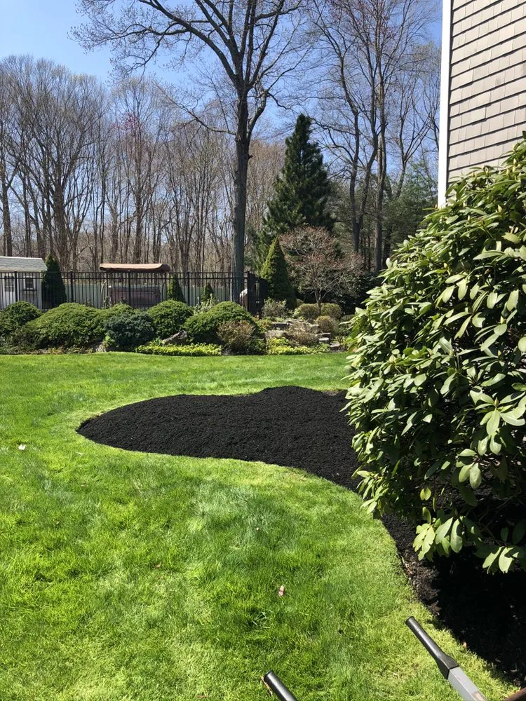 Professional outdoor landscaping for homes in Coventry, RI by The Big Family Landscaping