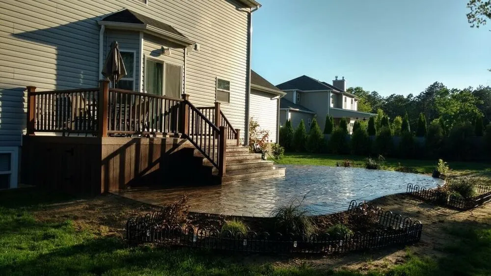 Custom garden landscaping in Greenlawn, NY by The Deck And Patio