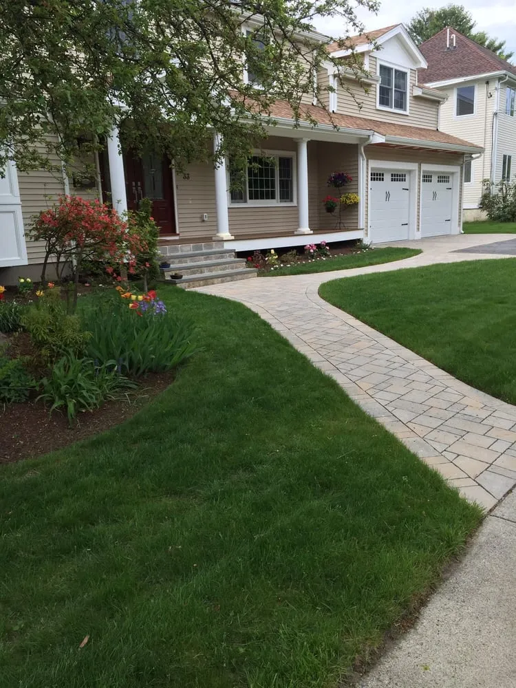 Custom yard cleanup service for residential properties in West Roxbury, MA by The Finest Landscaping