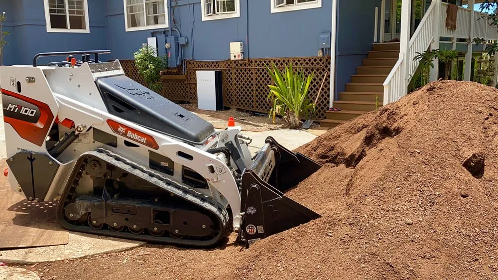Affordable yard cleanup service for outdoor upgrades across Urban Honolulu, HI - The Friendly Bobcat