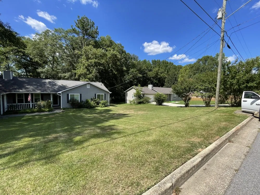 Professional lawn care service experts serving Carrollton, GA - The Grass Father Lawn Maintenance