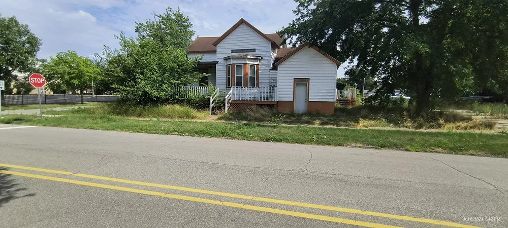 Affordable yard maintenance for residential properties in Michigan City, IN by The Grass Krew