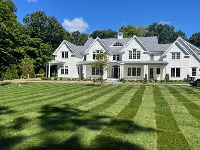 Professional landscape installation for residential properties in Darien, CT by The Growing Concern
