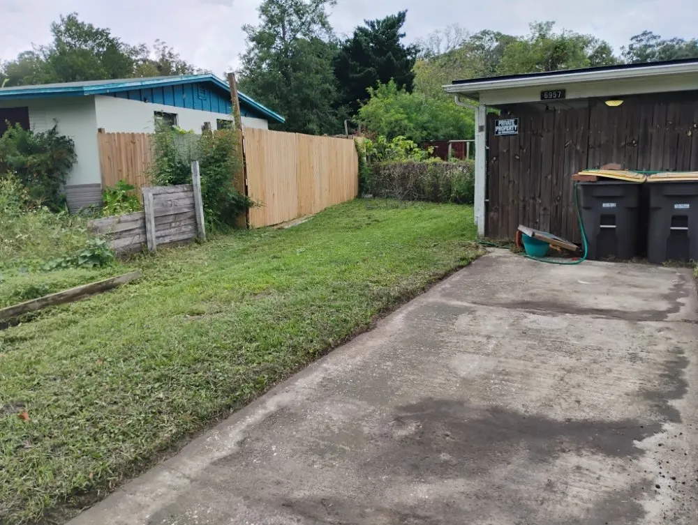 Local lawn mowing service for residential properties in Jacksonville, FL by The Handy Guru Lawn Care Service