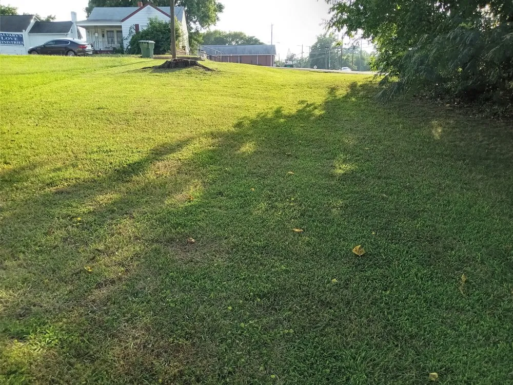 Custom residential landscaping for year-round maintenance in Hopewell, VA by The Hughes People Lawn Care