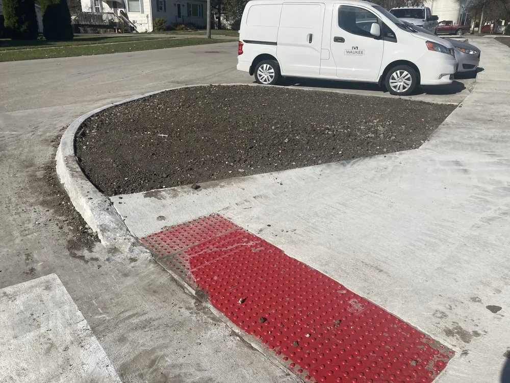 Local lawn mowing service with custom design in Des Moines, IA by The Landscape Company