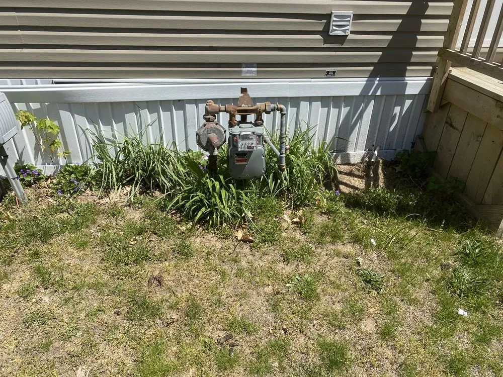 Custom landscape installation for year-round maintenance in Muskegon, MI by The Lawn Barber