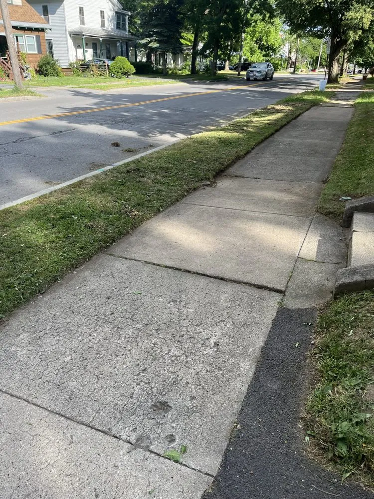 Affordable lawn mowing service with custom design across Syracuse, NY - The lawn barber