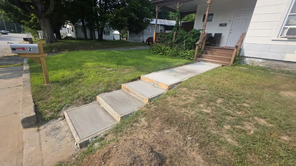 Professional lawn mowing service for residential properties in Warrensburg, NY by The Lawntrapenuer