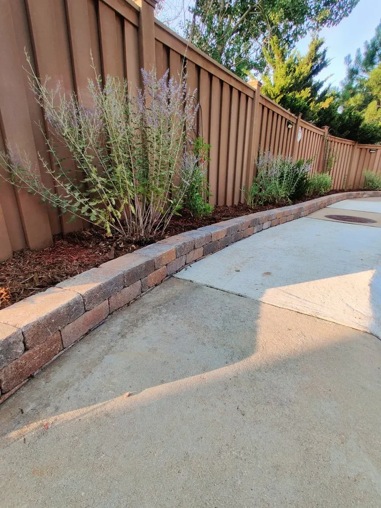 Custom yard cleanup service for year-round maintenance in Denver, CO by The Little Guy Pavers