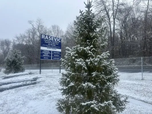 The Rasevic Companies Logo