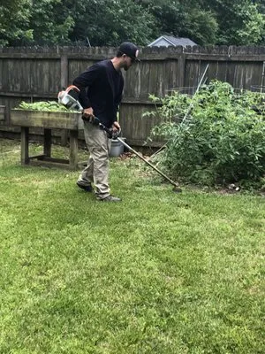 The Rock Lawn Care Logo