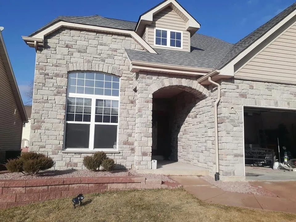 Professional lawn mowing service for residential properties in Bridgeton, MO by The Stone Men