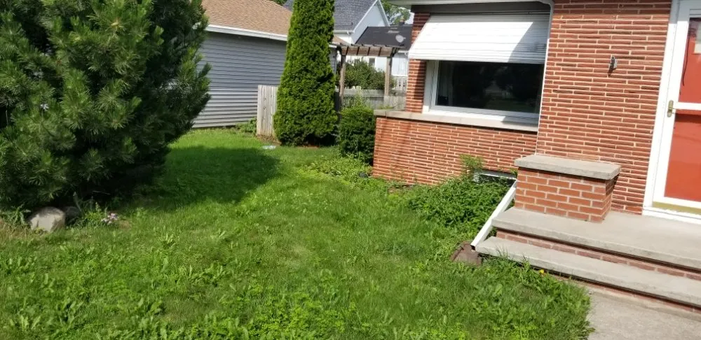 Professional landscape installation with custom design in Kimberly, WI by The Yard Artist