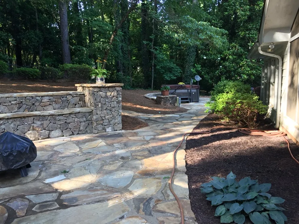 Custom landscape installation for outdoor upgrades in Loganville, GA by The Yard Man