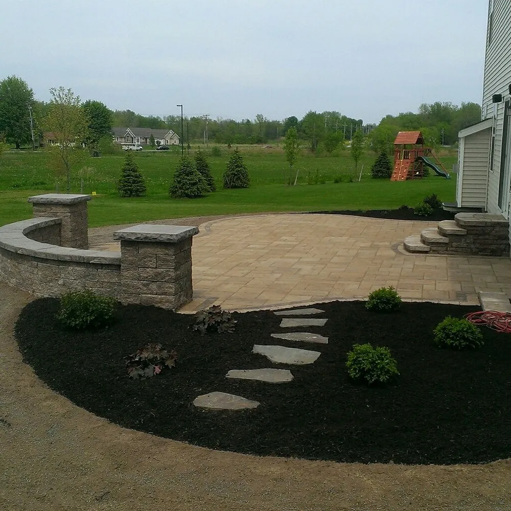 Affordable lawn mowing service for outdoor upgrades in Webster, NY by Thomas Landscape & Design