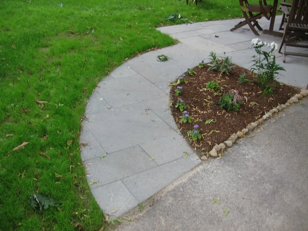 Local lawn mowing service with custom design in West Roxbury, MA by Thoreau Landscape Company