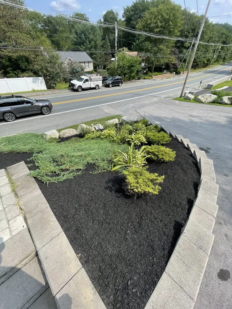 Professional residential landscaping for year-round maintenance in Shrewsbury, MA by Thoren Lawn & Tree