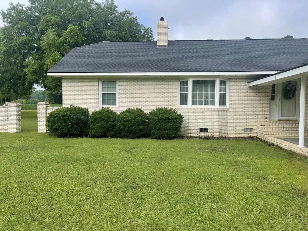 Professional lawn mowing service with custom design in Lumberton, NC by Thorndyke Lawncare and Landscaping