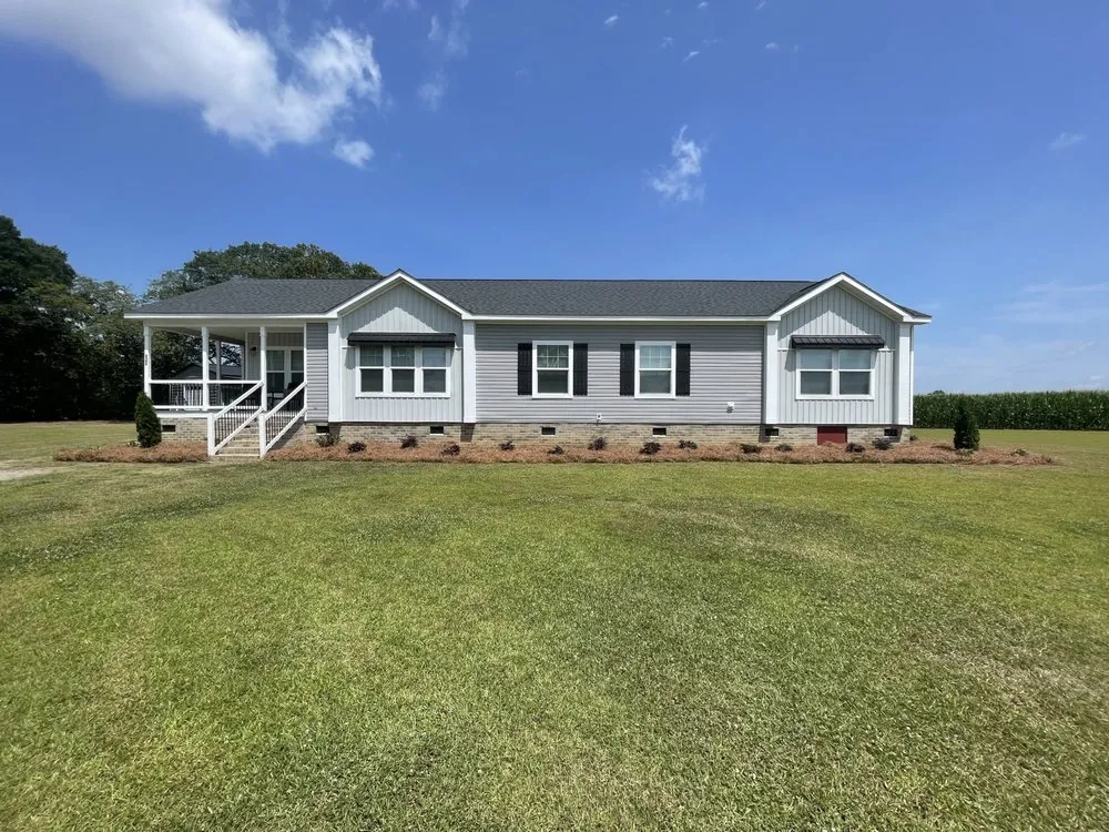 Custom landscape installation for residential properties in Lumberton, NC by Thorndyke Lawncare and Landscaping
