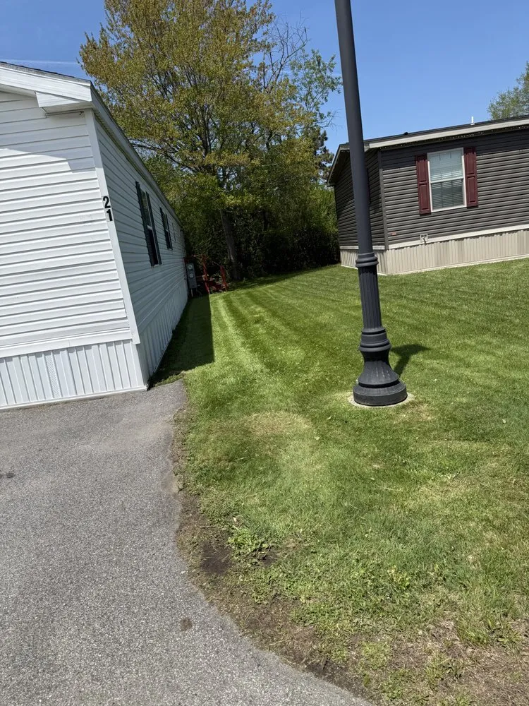 Top-rated lawn mowing service with custom design in York, ME by Three Pines Property Services