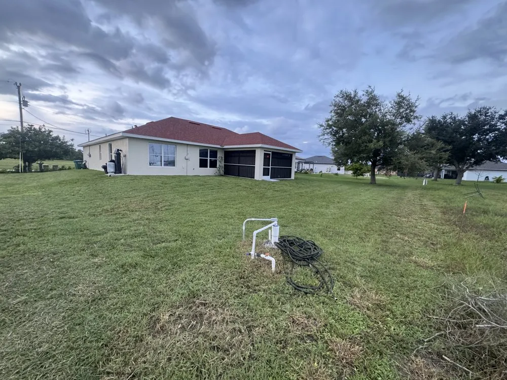 Professional lawn mowing service with custom design in Cape Coral, FL by Tier One Aesthetics