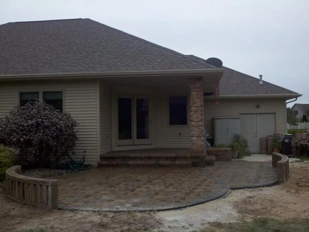 Affordable lawn mowing service for homes in Brillion, WI by Timmers Hardscapes