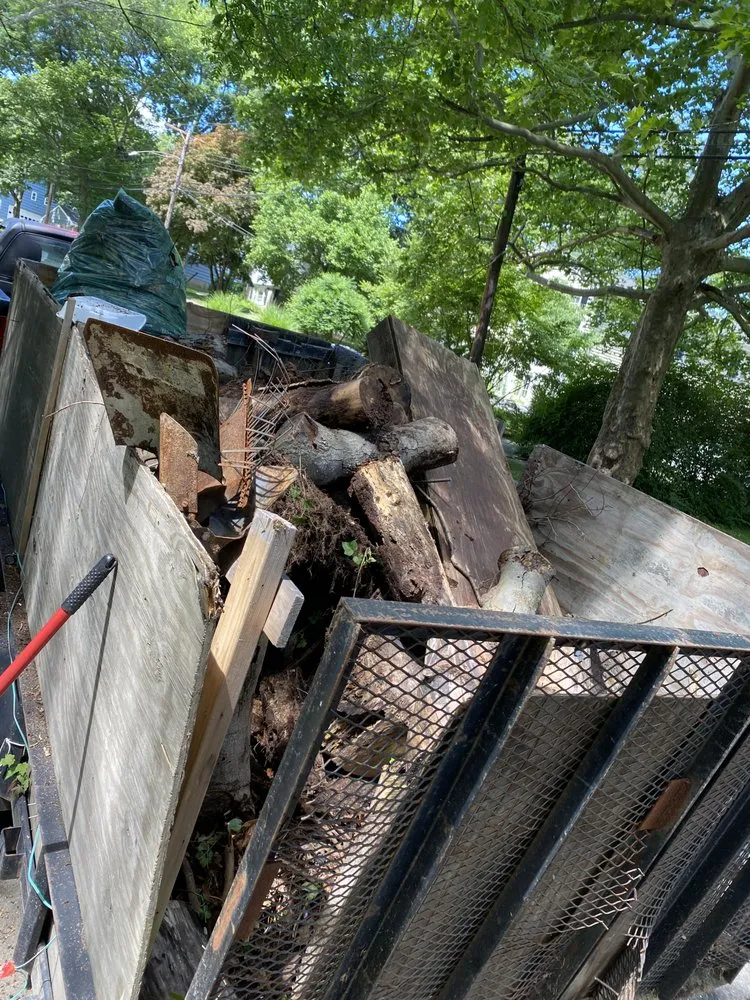 Custom residential landscaping with custom design in Milford, CT by Tim’s In And Out Lawn Service And Junk Removal