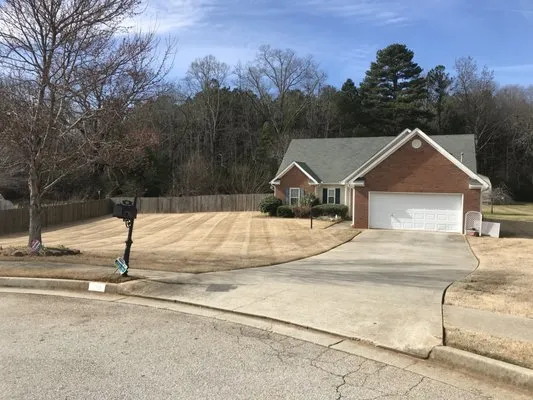 Tim's Lawn Care and Landscaping Logo