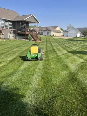 TJ Lawn & Landscaping Logo