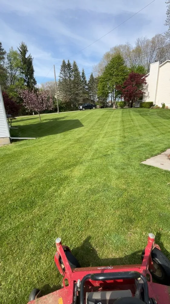 Reliable lawn mowing service in Howell, MI by TJH Outdoor