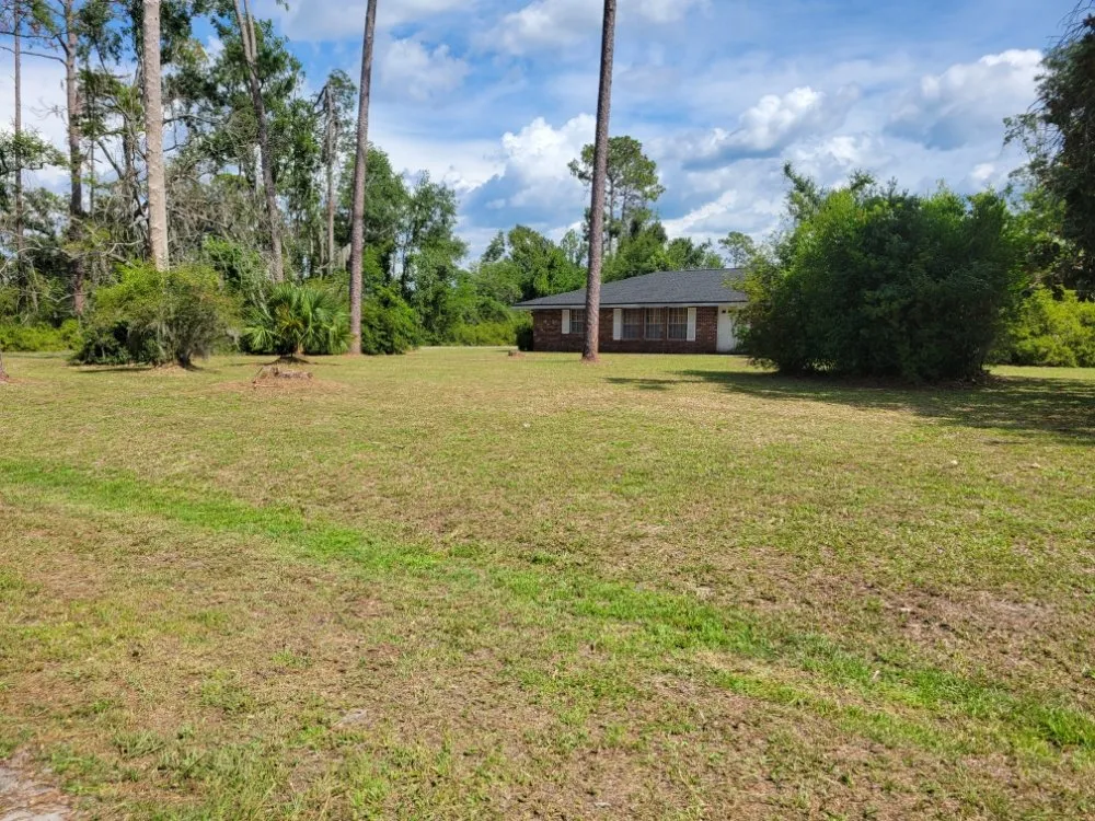 Expert lawn mowing service with custom design across Perry, FL - TJ'S Lawn Works & More