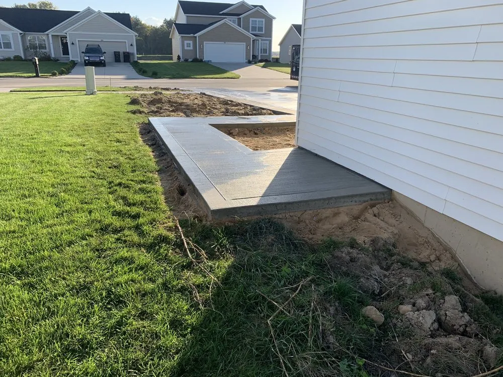 Custom lawn care service for year-round maintenance in Holland, MI by TLC Concrete and Landscape