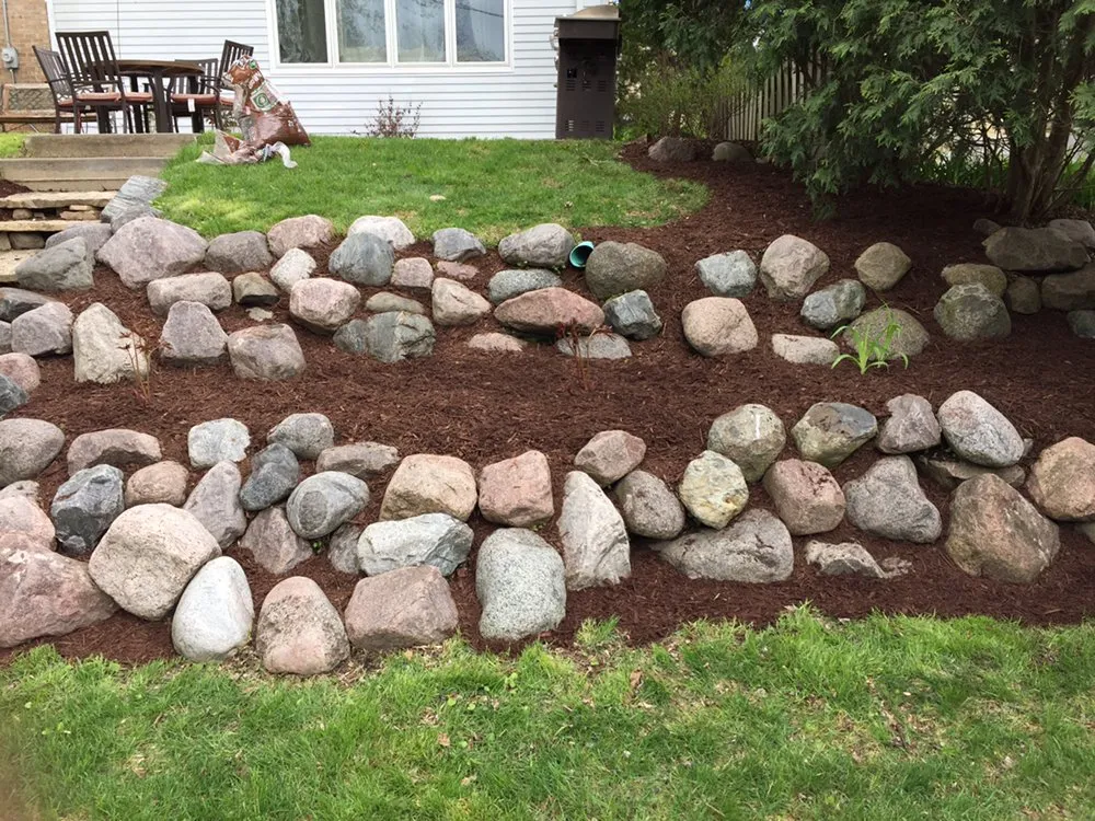 Affordable yard cleanup service for beautiful yards across Milwaukee, WI - T.L.C. Construction & Landscaping