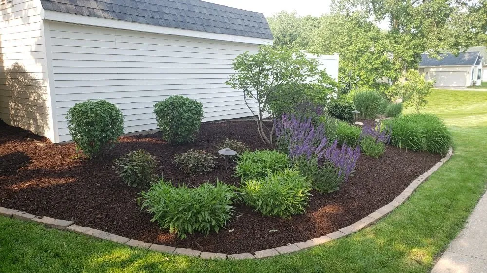 Trusted garden landscaping with custom design in Muscatine, IA by TLC Maintenance
