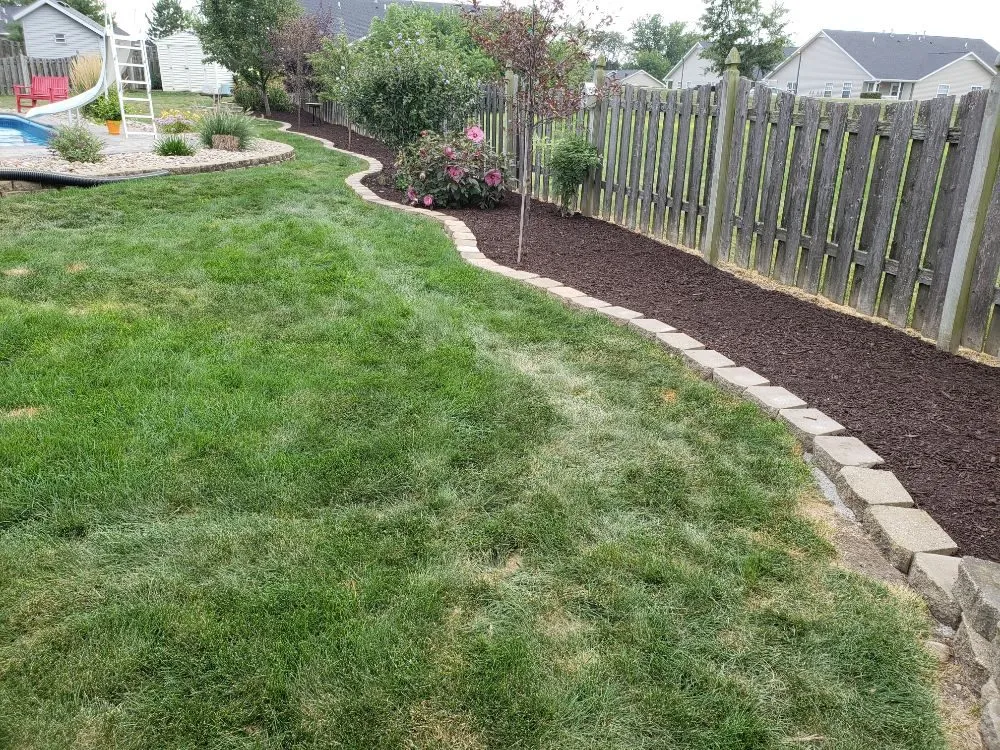 Custom landscaping services for beautiful yards in Muscatine, IA by TLC Maintenance