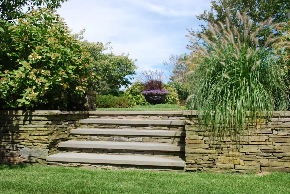 Custom landscape installation in East Quogue, NY by TLC Tree And Lawncare