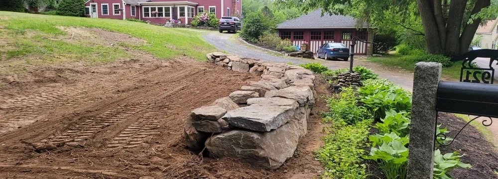 Local outdoor landscaping for year-round maintenance in Dunstable, MA by TMC Lawn & Landscape