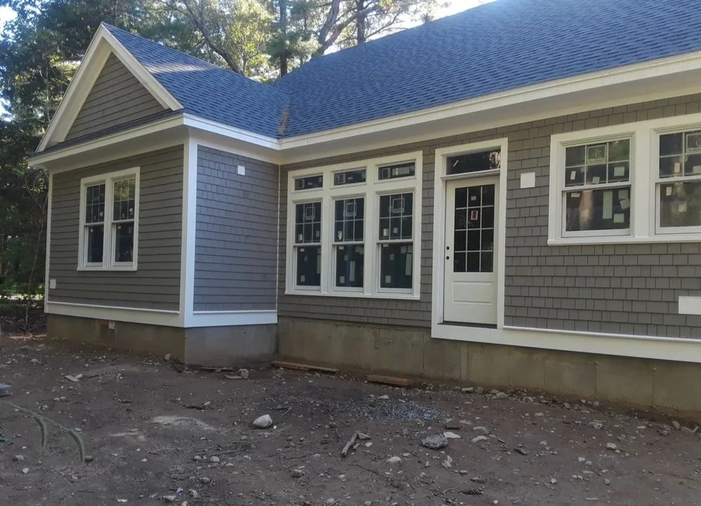 Custom landscape design for year-round maintenance in Revere, MA by TMD Remodeling