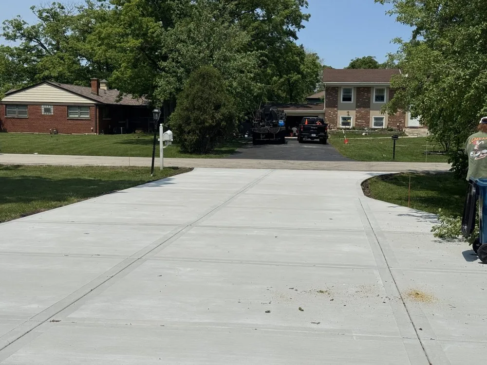 Professional yard cleanup service for homes in Elk Grove Village, IL by TMW Enterprises Paving & Maintenance