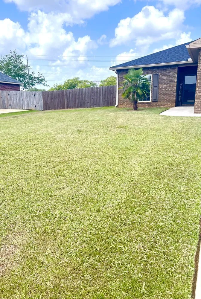 Professional outdoor landscaping with custom design across Robertsdale, AL - TNT Dynamite Lawn Services