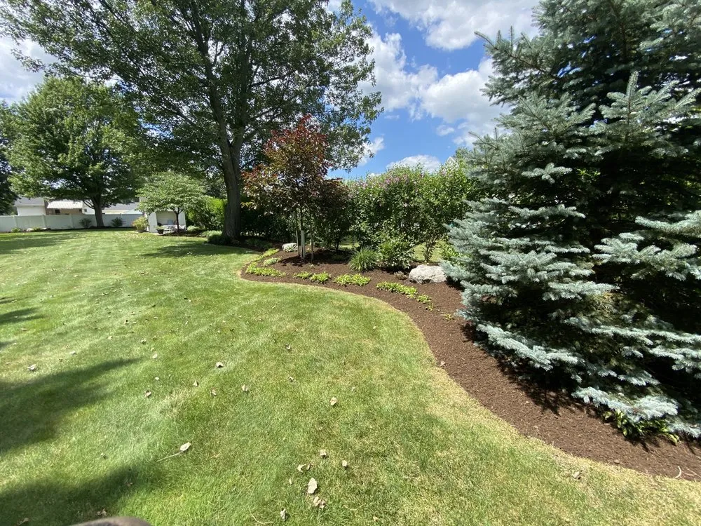 Professional lawn mowing service for homes in Batavia, NY by TNT Exteriors