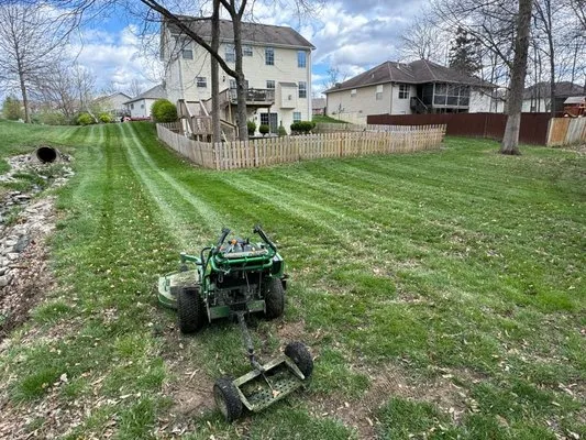 Tolmie’s Lawncare Logo